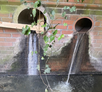 example of an outfall discharging water into a river